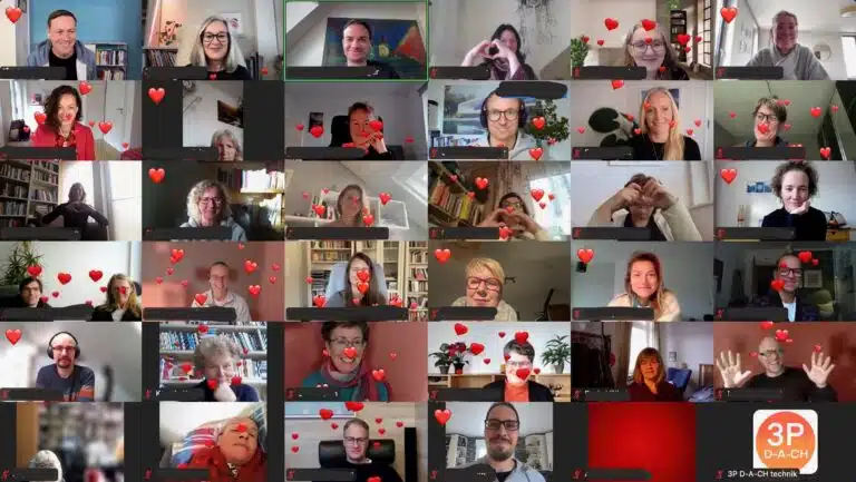 Teilnehmende der 3 Prinzipien Konferenz 2024 in einer Videokonferenz mit eingeblendeten Herzen